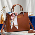elegant faux leather handbag with scarf